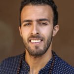 Portrait of a smiling Arab man. About 25 years old, Middle Eastern male.